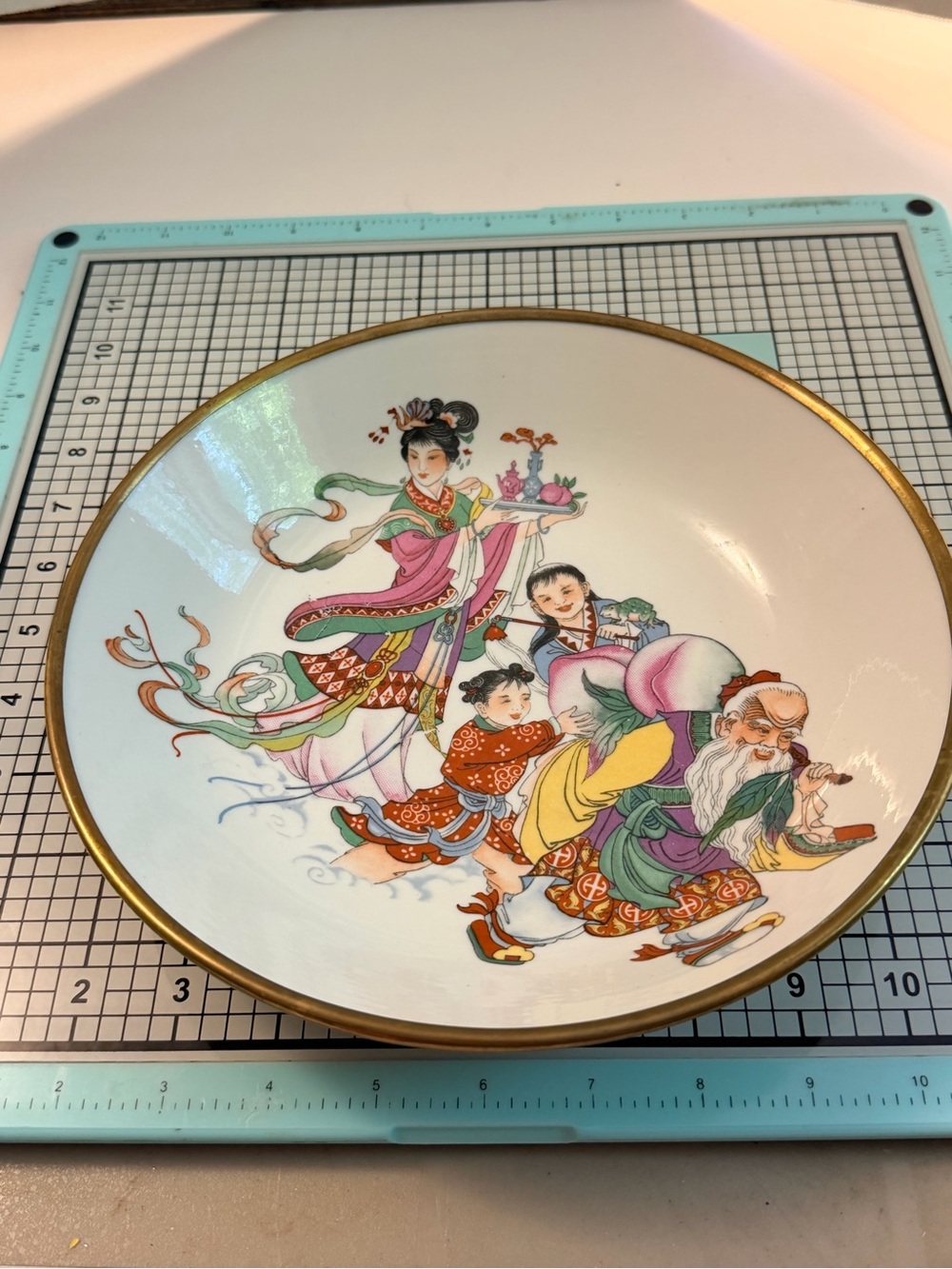 Decorative Porcelain Bowl with Hand-Painted Chinese Figures and Gold Rim